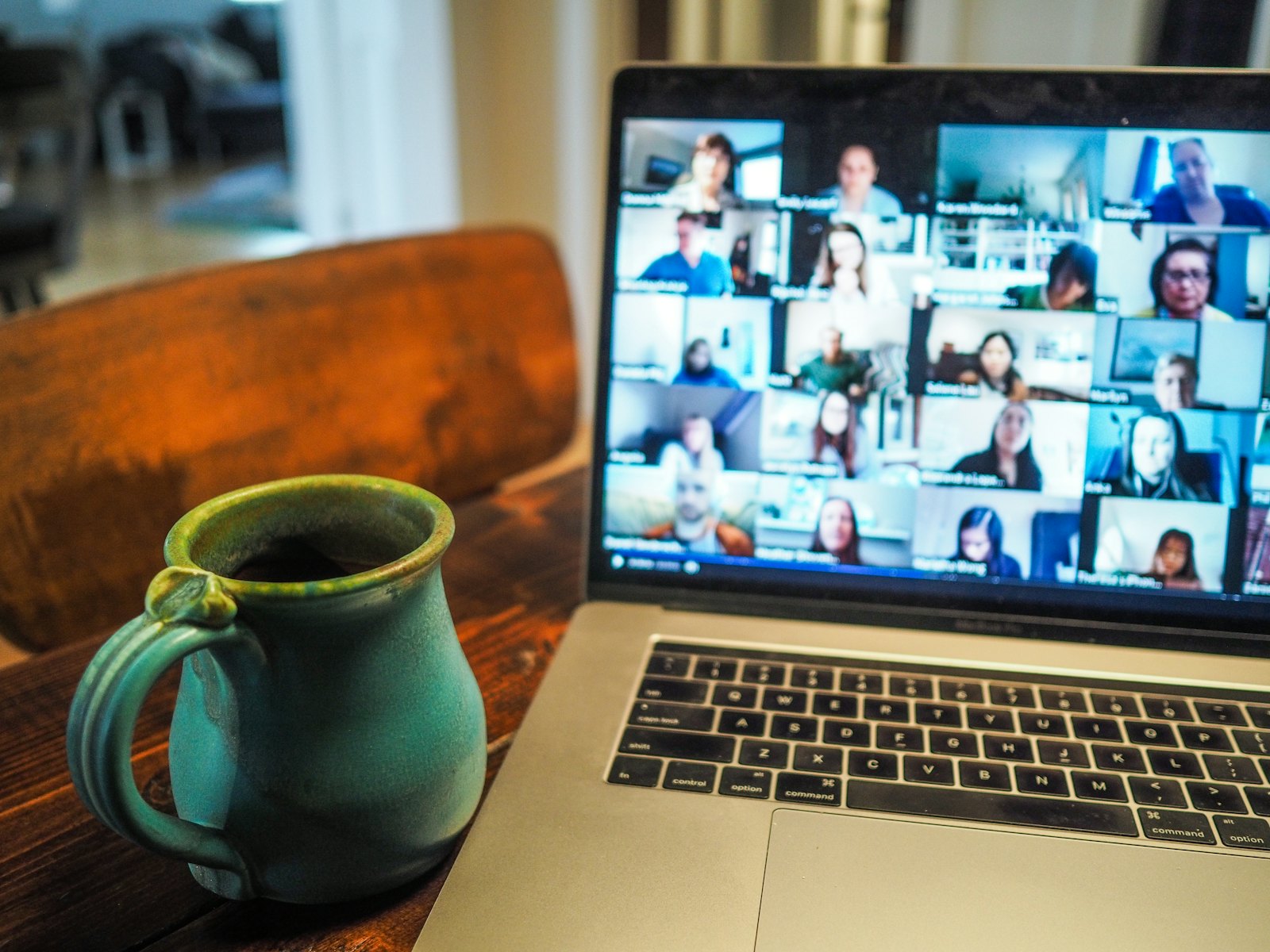 Laptop showing a video call with a remote team
